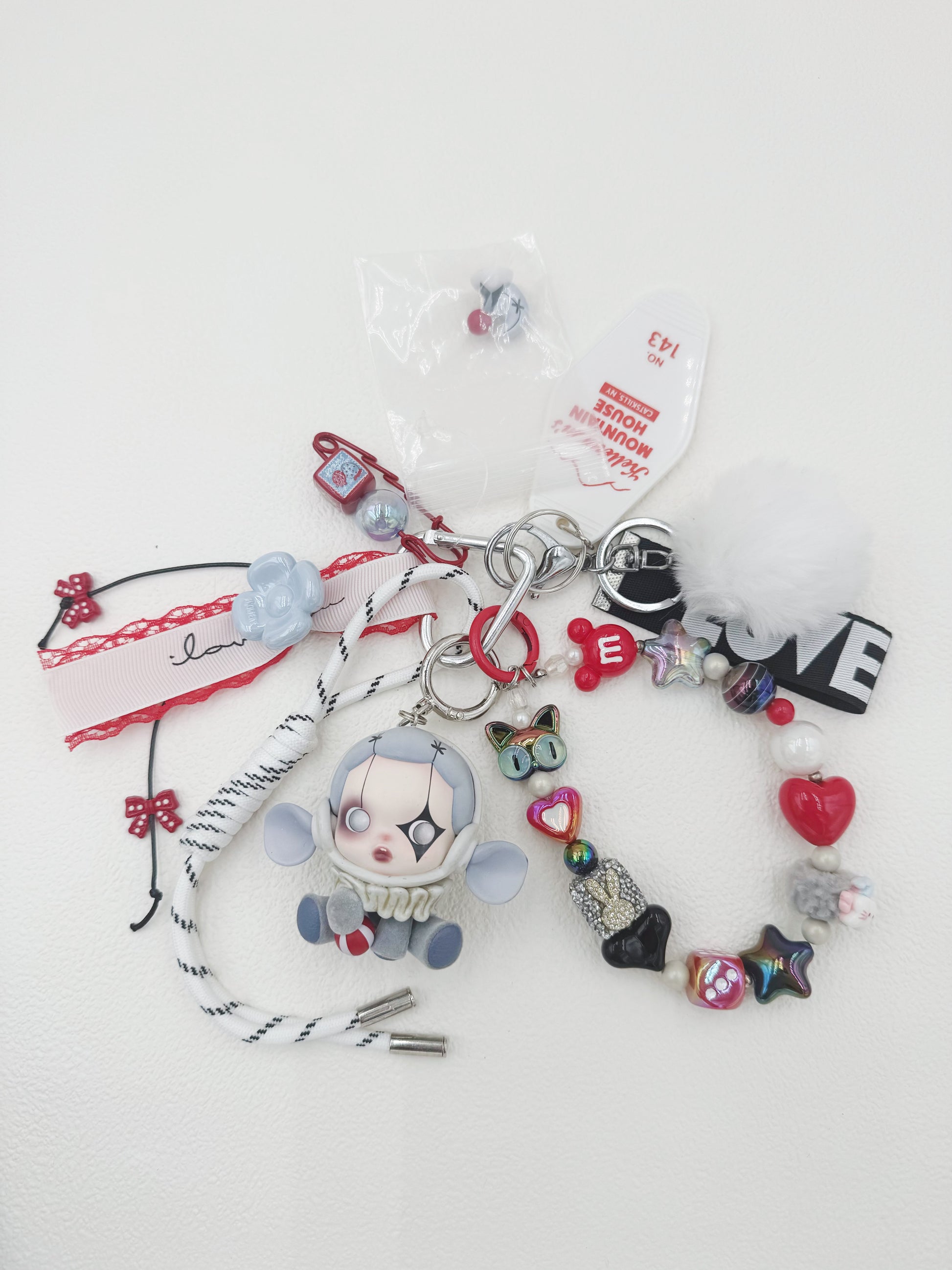 Handmade Skullpanda beaded bag charm and keychain rhinestone accents