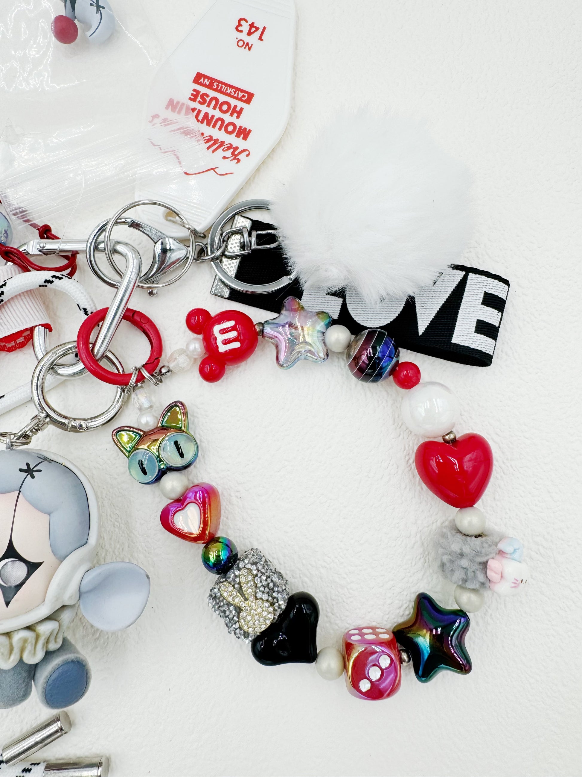 Handmade Skullpanda beaded bag charm and keychain rhinestone accents